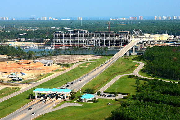 The Orange Beach Expressway toll road leading to The Wharf Condominiums under construction